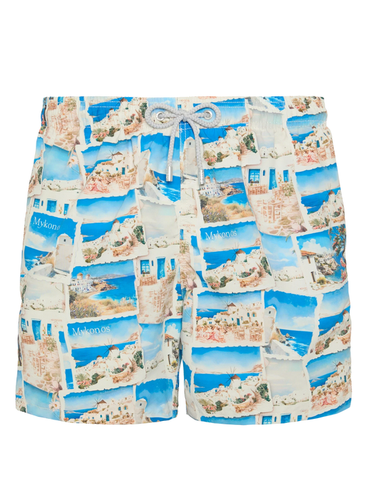 Mid-length Gustavia swim-shorts with Mykonos postcard print | AI CO-CREATED DESIGN BY RICKDICK - POWERED BY RED-EYE