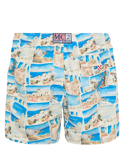 Mid-length Gustavia swim-shorts with Mykonos postcard print | AI CO-CREATED DESIGN BY RICKDICK - POWERED BY RED-EYE