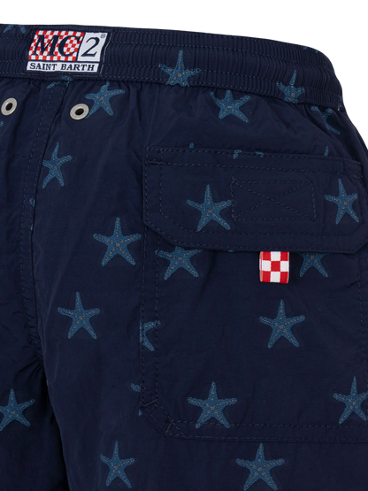 Patmos Jr mid-length swim shorts with seastar jacquard